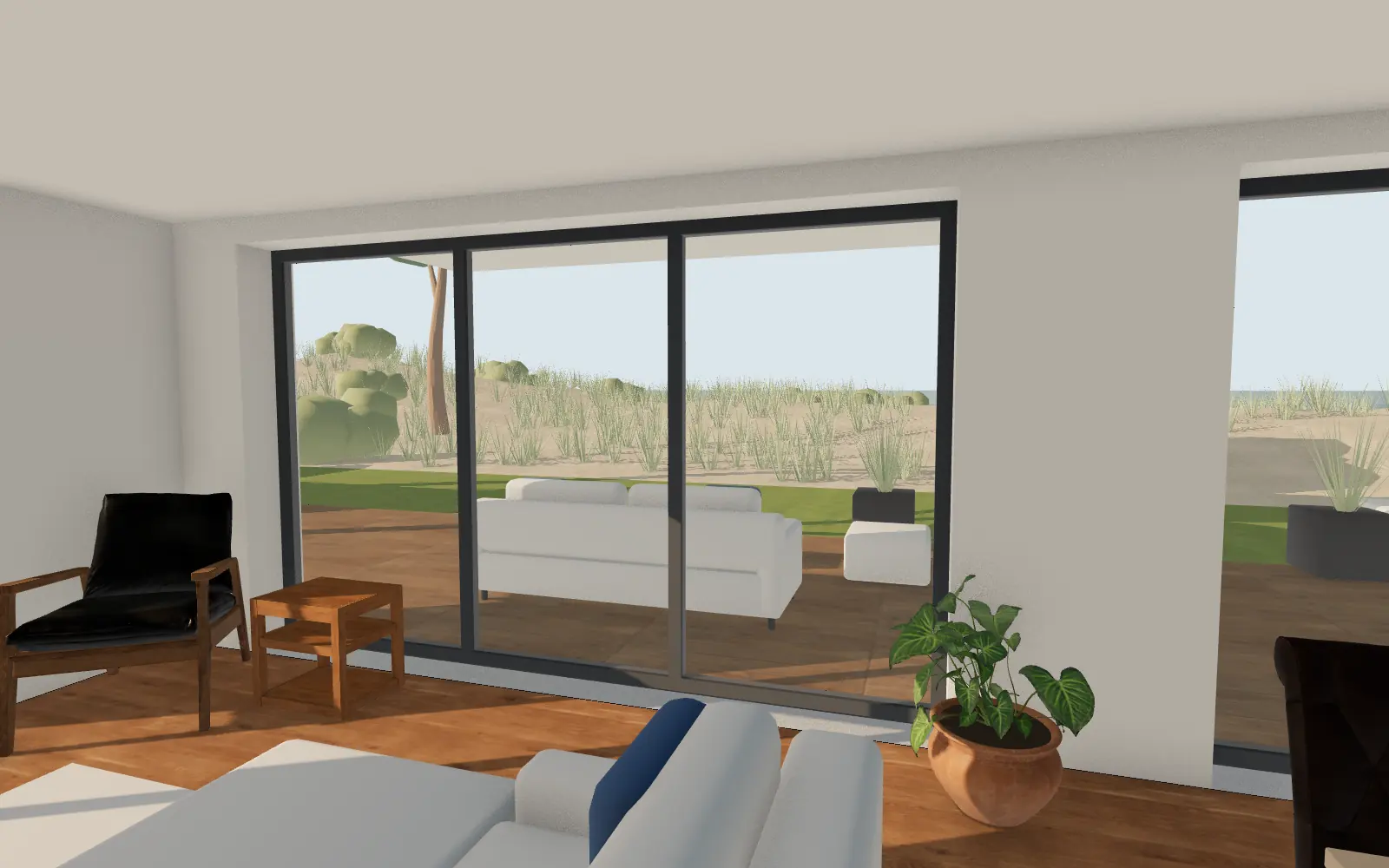Living, dining and kitchen with a view to the dunes and the sea.